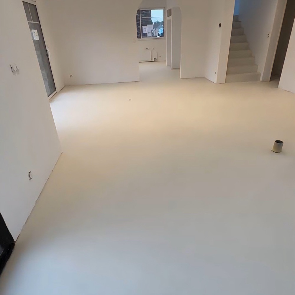 After: seamless gray microcement over old tile